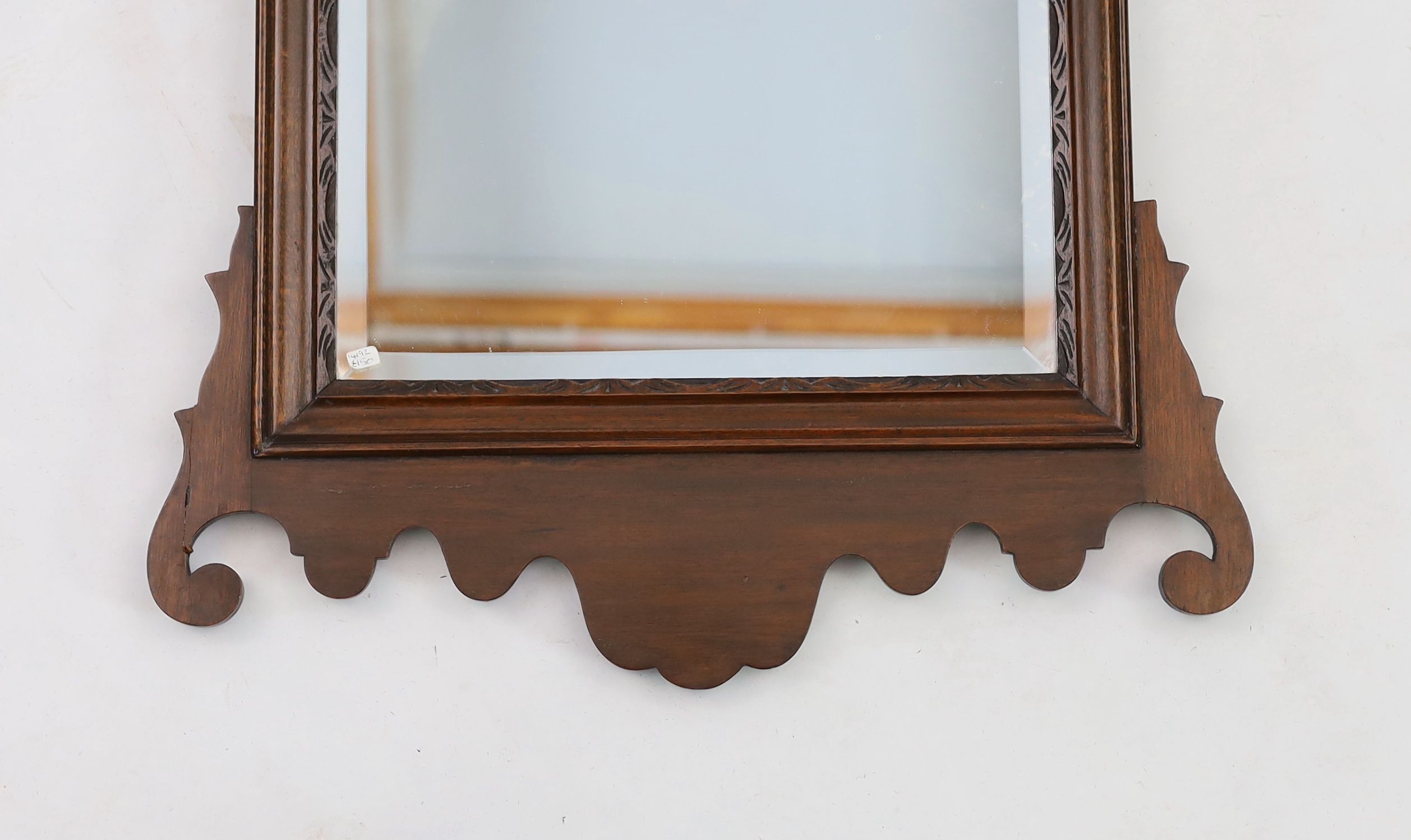 A George III style mahogany fret cut wall mirror, width 50cm height 88cm